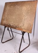 A vintage mid 20th century Industrial architects draughtsman table with cast iron / metal painted