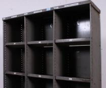 An vintage Industrial metal 18 hole pigeon hole / parts bins shelving system.