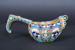 A highly detailed Russian white metal (tested as silver ) and enamel decorated Kovsh