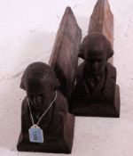 A pair of Victorian cast iron fire dogs, decorated with figural busts to the ends,