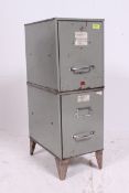 A vintage / retro 20th century metal filing cabinet on tapered supports having original grey
