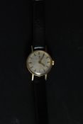 A ladies 9ct Omega gold wristwatch complete with the leather strap,
