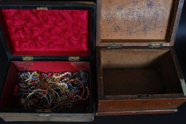 Two boxes, one filled with assorted costume jewellery.