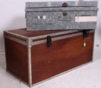 A large wooden steamer trunk being metal bound bearing shipping label for the Peninsular & Oriental