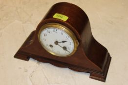 A french edwardian inlain mantel clock having ceramic face bearing marks to the rear,
