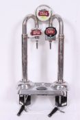A twin Stella Artois beer pump with notation panels to each pump finished in chrome.