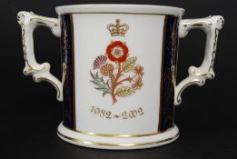 A Royal Crown Derby limited edition Golden Jubilee twin handled loving cup by Hugh Gibson being a