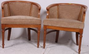 A pair of 20th century French fauteuil bergere style armchairs with  upholstered seat and caned