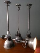 A single 1930's Industrial metal factory pendant light on tubular metal arm having swivel mechanism