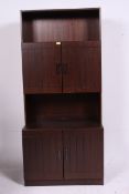 A Danish oak Denka Mobler a/s upright display cabinet sideboard having sectional body raised over