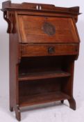 A Victorian Arts & Crafts solid oak students bureau in the manner of Liberty.