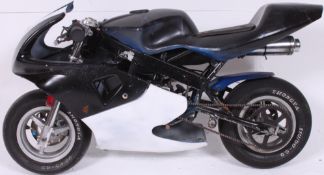 A Mini Moto style miniature engined motorcycle.
