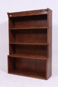 An early 20th century stacking oak lawyers bookcase having 4 sectional tiers,