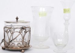 A early 20th century etched celery glass along with a silver plated biscuit barrel with its glass