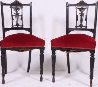 A pair of Edwardian mahogany ebonised bedroom chairs having red velour overstuffed seats with