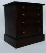 A Victorian mahogany apprentice piece chest of drawers having knob handles with flared top above