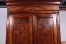 A 19th century French walnut armoire double wardrobe.