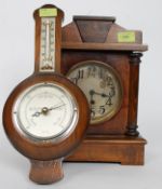 An Edwardian oak cased mantel clock having silvered dial together with a vintage wall aneroid