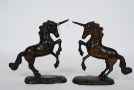 A pair of 20th century bronze Unicorns both mounted on naturalistic bases being unsigned