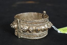 White metal bracelet with elaborate ethnic design. Weight 81g.