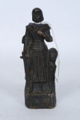 A bronze figure of Joan of Arc, modelled in battle dress, holding a sword,