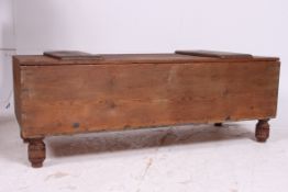 An unusual scratchbuilt  wooden casket chest of rectangular form with hinged top all on turned legs.