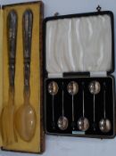 A hallmarked case of silver coffee beans spoons along with a cased set of French silver metal