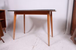 a fabulous retro 1950's formica and beech wood dining table having stunning original yellow mottle
