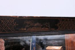 A small early 20th century oriental Japanese chinoserie decorated wall mirror,