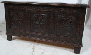 A 1950's Jacobean solid oak carved country coffer chest / blanket box.