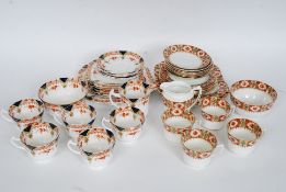 An extensive china part tea service by Wellington China, with floral pattern and gilded highlights.