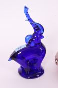 A collection of studio glass to include Bristol Blue elephant,