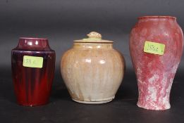 A collection of studio pottery to include drip glaze vase,