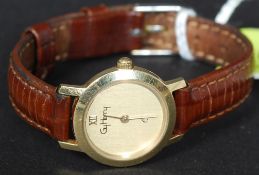 A Gy Henry 14ct gold / 585 marked wristwatch  having plain circular face set on leather strap