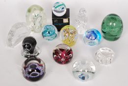 A collection of 13x glass paperweights - Scandinavian, Caithness, Selkirk and others.