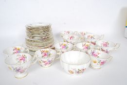 A Royal Crown Derby part tea service in a chintz posy pattern comprising cups, saucers, teapot,