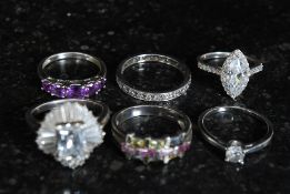 A selection of 6 silver ladies dress rings to include amethyst and and CZ stones. Total weight 21g.