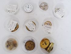 A quantity of vintage watch making / pocket watch spares (x15 small pots).