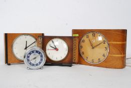 A collection of retro clocks to include a Kienzle, Smiths,