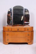 A 1930's Art Deco birds eye maple and walnut flash ladies dressing table chest of drawers.