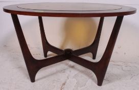 A 1970's Atomic / Sputnik style teak wood and yellow mottle glass circular coffee table being