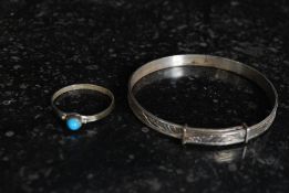 Sterling silver christening bangle together with a silver ring set with a turquoise gem stone.