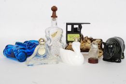 A collection of 8x Avon vintage aftershave bottles, in novelty shapes - some with contents.