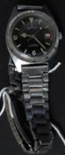 A vintage gentlemans Services military issue black faced mechanical wristwatch.