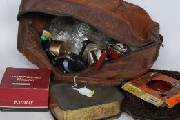 A collection of fishing items to include vintage reels, hooks, Intrepid Rimfly,