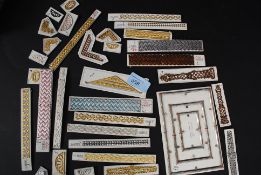 A collection of thin mounted spandrels and decorative clock mounts , furniture embellishments etc,