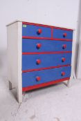 An early 20th century Shabby Chic painted two tone chest of drawers.