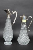 A near pair of glass and silver plate claret jugs. It has a 30cm height.
