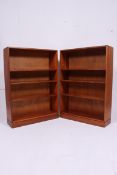 A pair of 1960's retro teak wood Air Ministry open window bookcase cabinets having shelved centres
