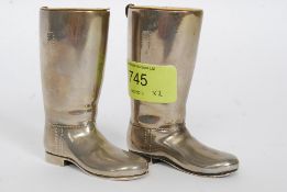 A pair of heavy silver plated drinks measures in the form of riding boots - hunting interest.
